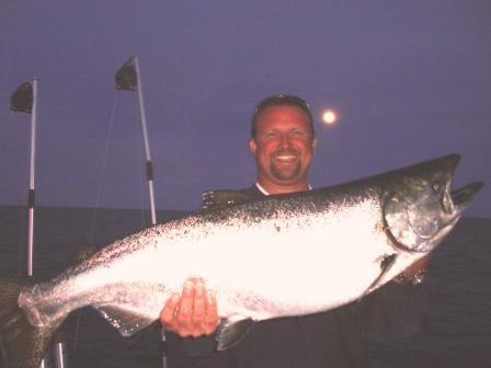 Happy angler aboard Fish Tales Charters!