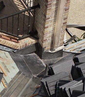 This was a tricky dead valley the architect left on us. The original counter flashing wasn't tall enough to waterproof this roof.