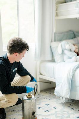 Ensuring a safe and pest-free environment for your little ones!  Our technician is performing a kid and pet-safe treatment for spiders