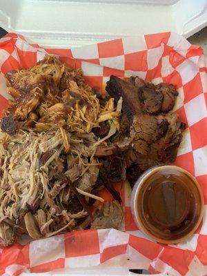 Chicken , brisket, pulled pork, and little cup of bbq sauce.