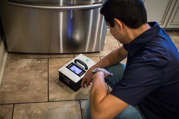 Felix measuring the dynamic coefficient of friction (DCOF) of tile floors using our state of the art tribometers, the BOT-3000E.