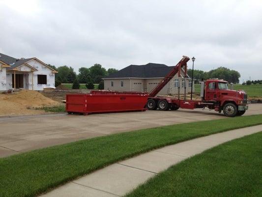 Dumpster Delivery in Rock Island, Illinois for a new construction project.