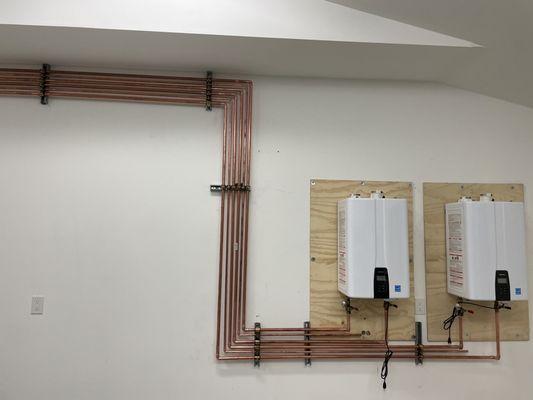 2 new on demand water heaters with artistic copper piping by special request