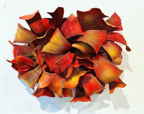 Red organic wall sculpture made of aluminum