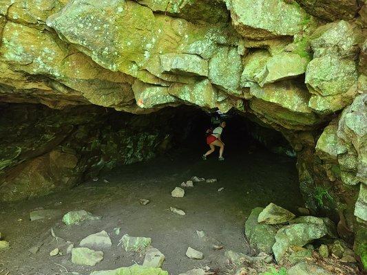 The cave you see when you arrive in a small parking lot. Safe to go in!