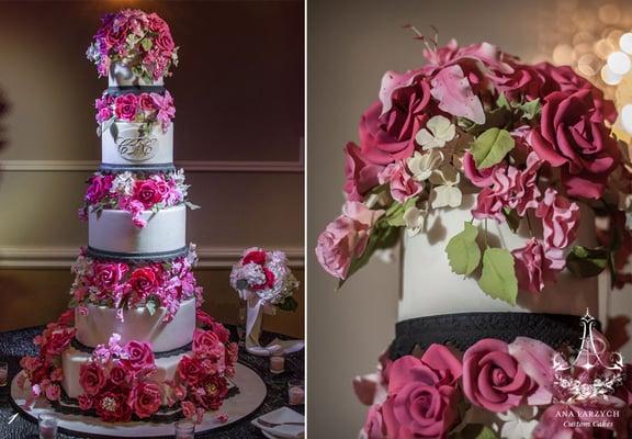 Wedding cake consisting of eight round tiers with sugar roses, peonies, sweet peas, hydrangeas, and lilies in hot pink shades