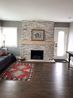 Our office with hardwood floors and updated original 1940s fireplace.