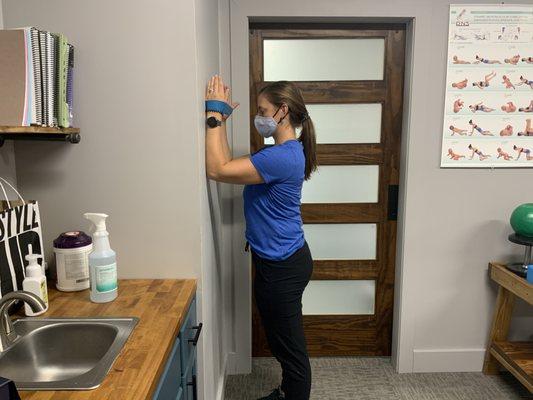 Dr. Abby demonstrating exercises to patients. Rehab is a large part of treatment plans at Restore Chiropractic & Rehab.