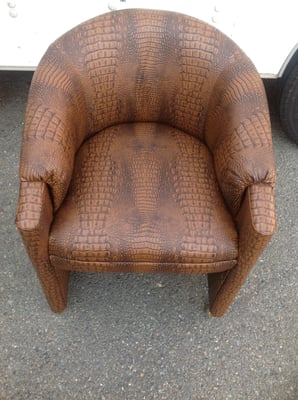 This Chair was original cover with cloth fabric, its now cover in Gator  skin