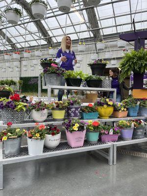 Kathy Canoyer and a variety of flowers in containers