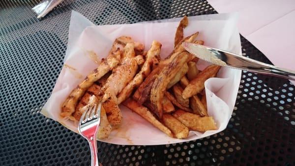 Naked chicken fingers with mango habanero sauce, and a side of fries.