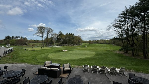 View of the 18th green and practice area from the patio at Hemlock.