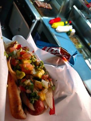 Bacon Wrapped Hot Dog with Onions, Peppers, Avocado, Pico de Gallo, Chips and Drink for only $4.00!