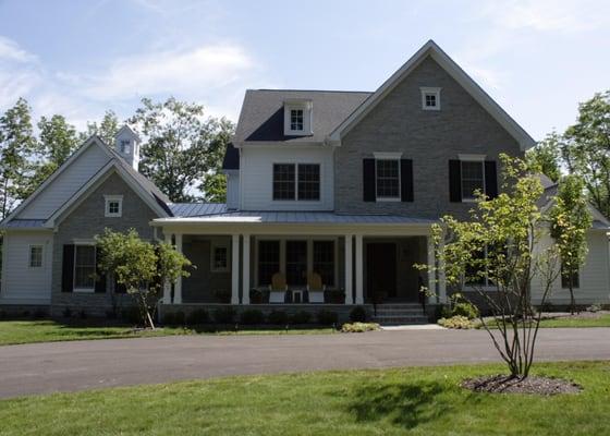 This custom home was finished with natural stone and hardi-plank siding.