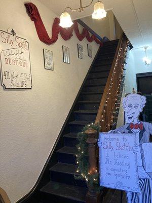 The Butler in the Foyer, eagerly waiting to greet guests and direct them to the Upstairs Studio.