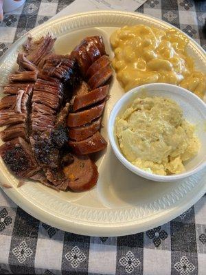 Brisket, jalapeño sausage, macaroni and cheese, and potato salad.