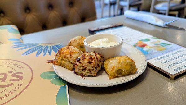 Lagniappe of green chile chedder biscuits and honey butter.