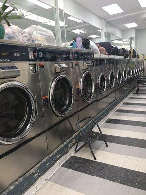 Lots of large and small washing machines.