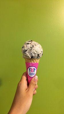 Single scoop of Oreos cookies n cream on a cone