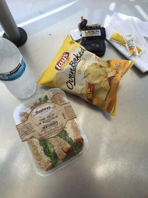 Tuna on whole grain with baked chips and water . $7