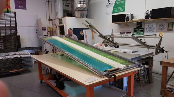 10' silk screen used to print 8' x 18" aluminum 2 color signs for Quick Space.