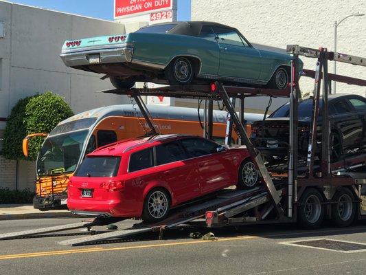 Undamaged car loaded on truck.