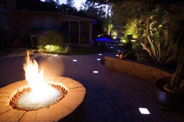 Lighted paver pathway with LED paver lights that leads from fire pit to custom lagoon pool.