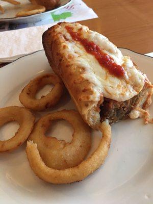 Eggplant parmigiana sub with onion rings.