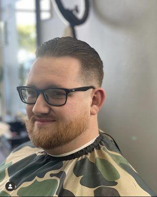 Low skin fade, beard trim with razor line up.