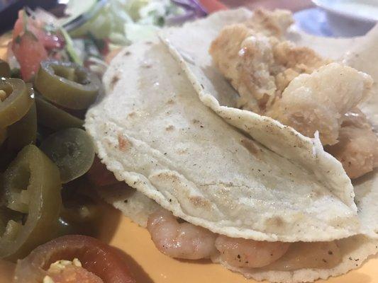 Fried fish and shrimp tacos with fresh handmade tortillas