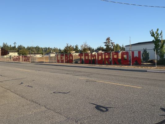 "Learn today lead tomorrow" fence art.