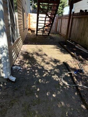 This is the before patio with all the dirt on the neck. You can't see the bricks at all.