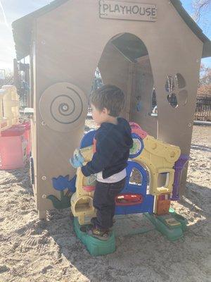 Playhouse in sandbox