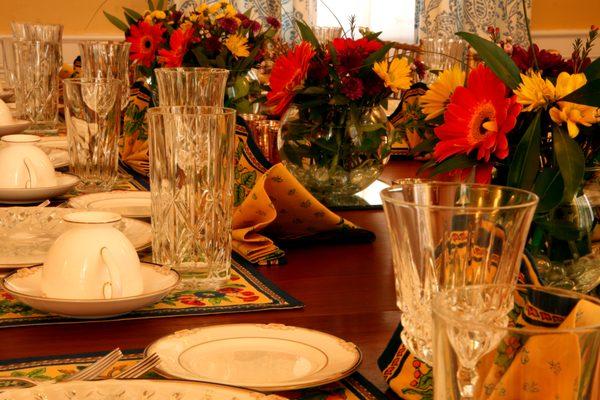 Fresh flowers, fine china and crystal grace the dining room tables.