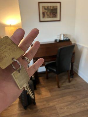 Real room key and antique desk