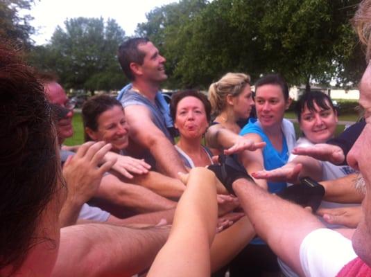 Worn out, tired, and loving it! Fitness by Example bootcampers get together after workout.