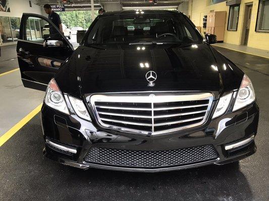 Step into the epitome of sophistication with White Glove Transportation Services' black on black Mercedes E-Class.