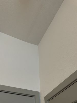 Sloppy paint job on ceiling. Present at move-in.