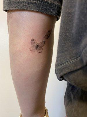 delicate butterfly tattoo