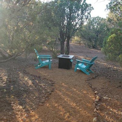 Sitting area with gas fire pit to read or enjoy the birds and soft breezes