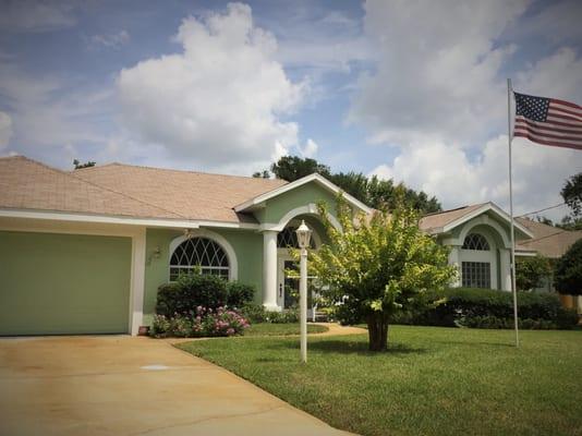 This grand fenestration pattern is highlighted in white, really making this patriotic home "pop."