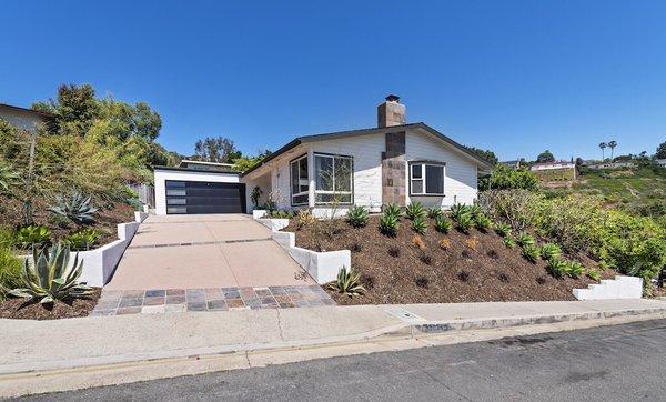 Darling Laguna Beach mid-century home in Top of the world. Single level four bedroom two bath home with ocean views!