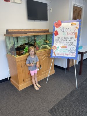 My daughter admiring the fish tank!