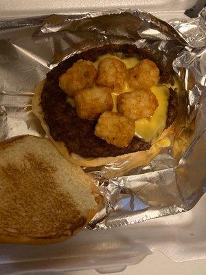 A sad dollop of cheese on an otherwise dry burger.