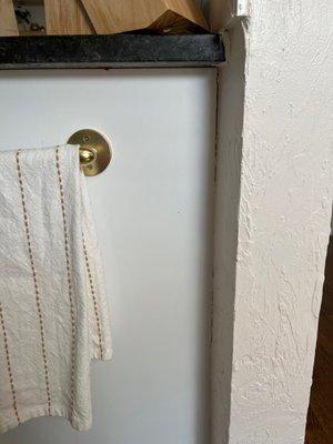 Cabinet pulling away from wall