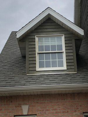 Stain that is dripping, sloppily applies on roof and windows.