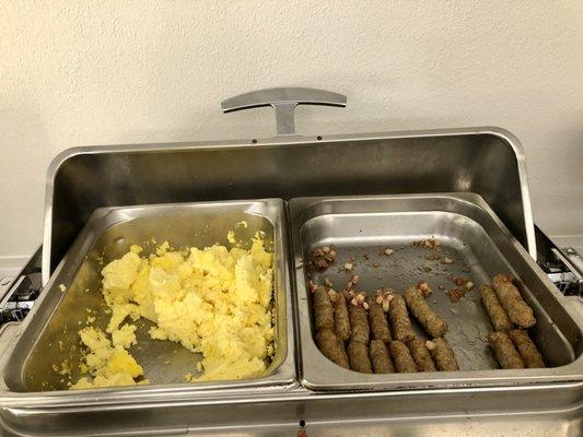 Free breakfast includes scrambled eggs & sausage. Some days, there's corned beef hash instead of sausage, & some days there's both