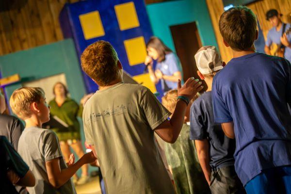 Worship is a highlight of the day at summer camp.