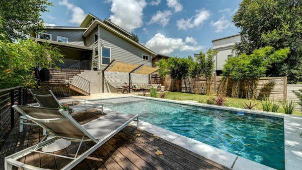 Take a dip in the sparkling swimming pool at our 3BR Luxury Oasis on Luna property.