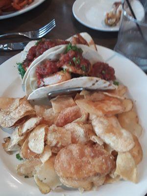 Blackened shrimp tacos with  slaw and salsa sides with parmesan chips